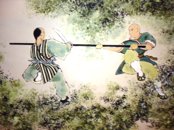 Peinture ancienne avec un baton long et des doubles couteaux